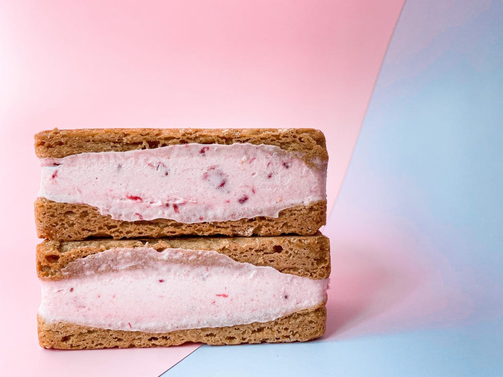 strawberry shortcake ice cream sandwich stacked with blue and pink background