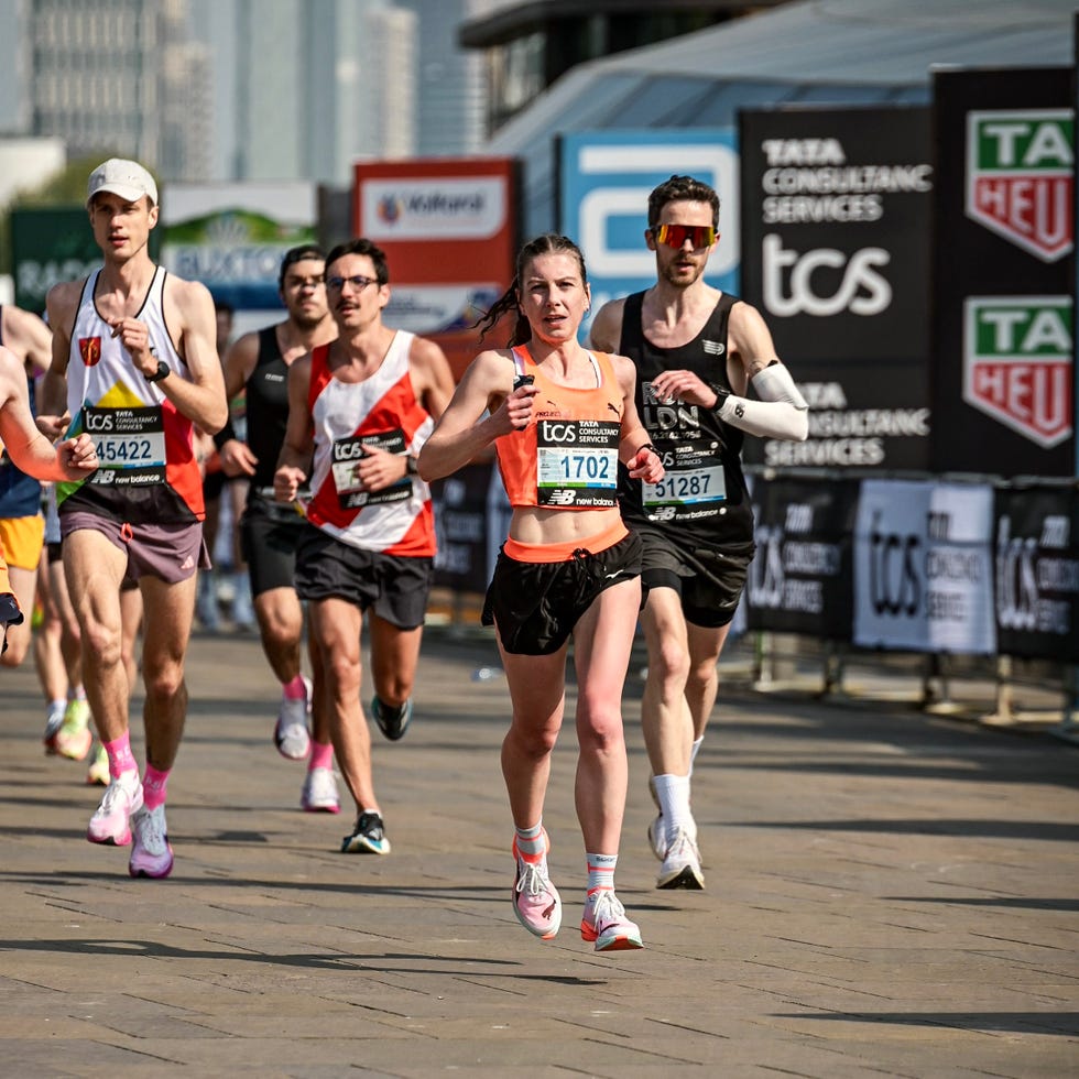 group of runners taking part in the london marathon