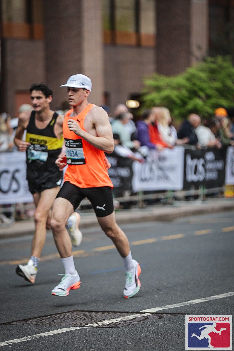 runners participating in a race on a city street