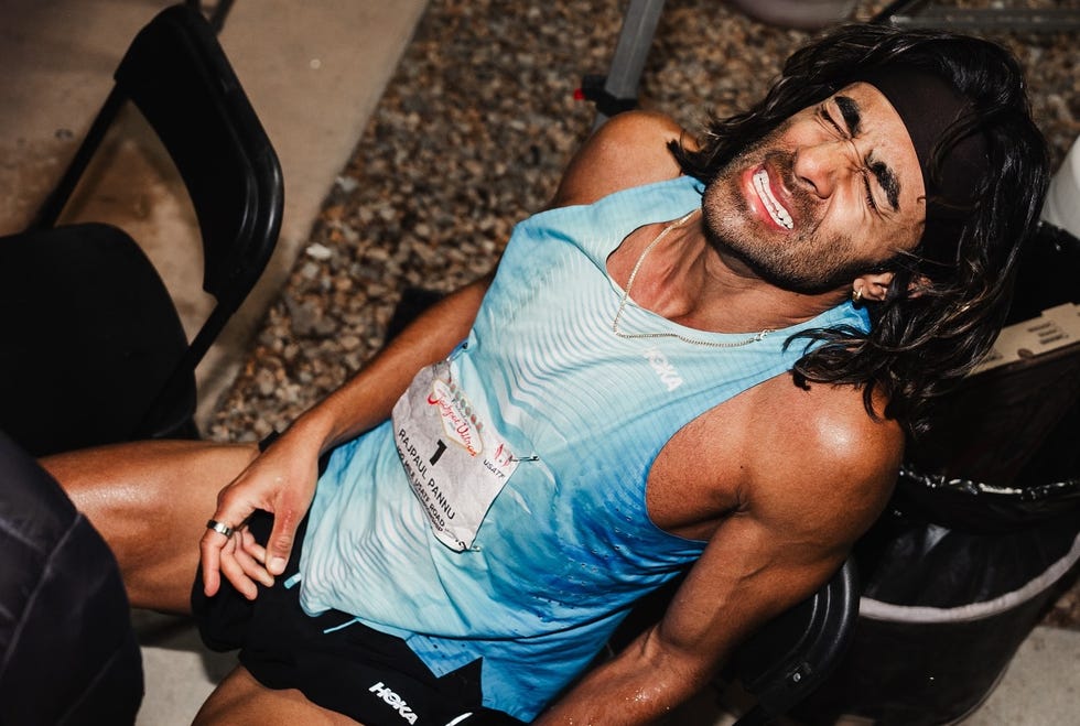 a runner resting in a casual setting after a race
