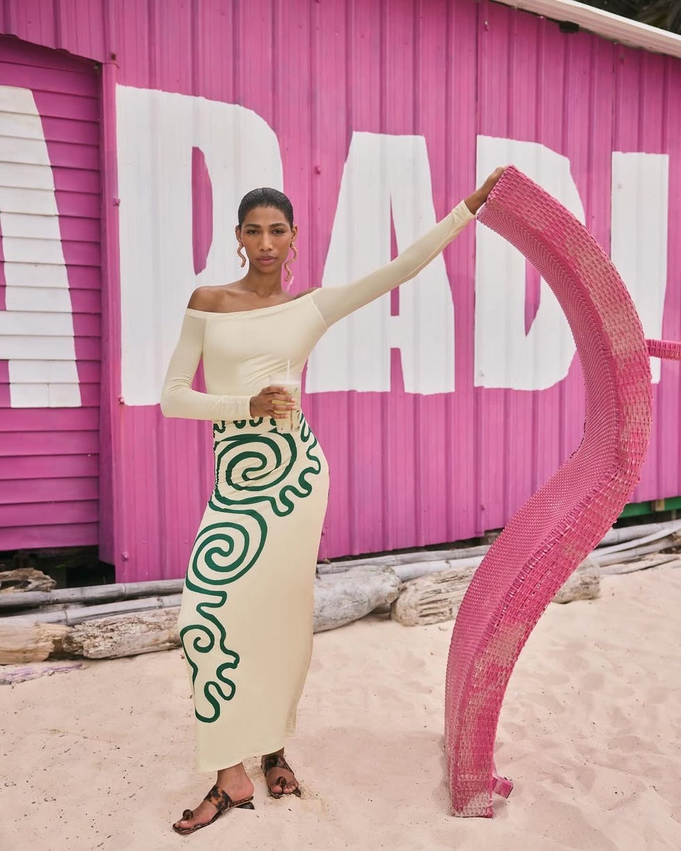 a person modeling a stylish outfit in a vibrant outdoor setting