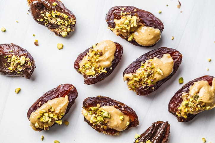 dates stuffed with peanut butter and pistachios, a healthy sweet snack