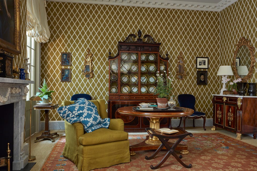 A vintage living room featuring intricate decor and antique furniture.