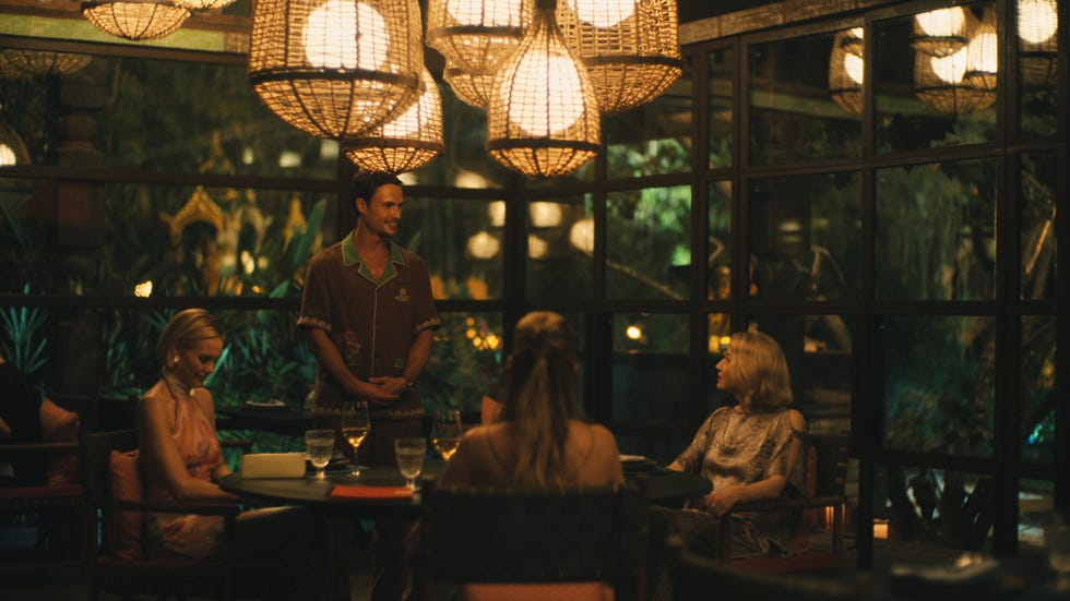 Dining scene in a restaurant with ambient lighting.