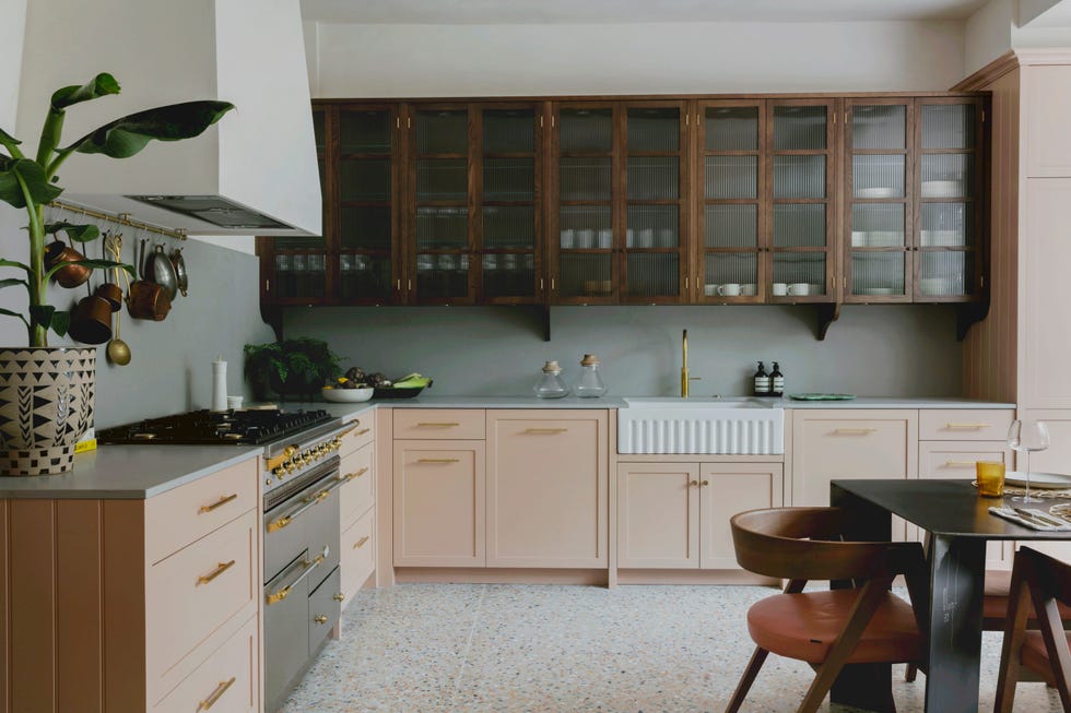 modern kitchen with terrazzo floor and pale pink cabinets