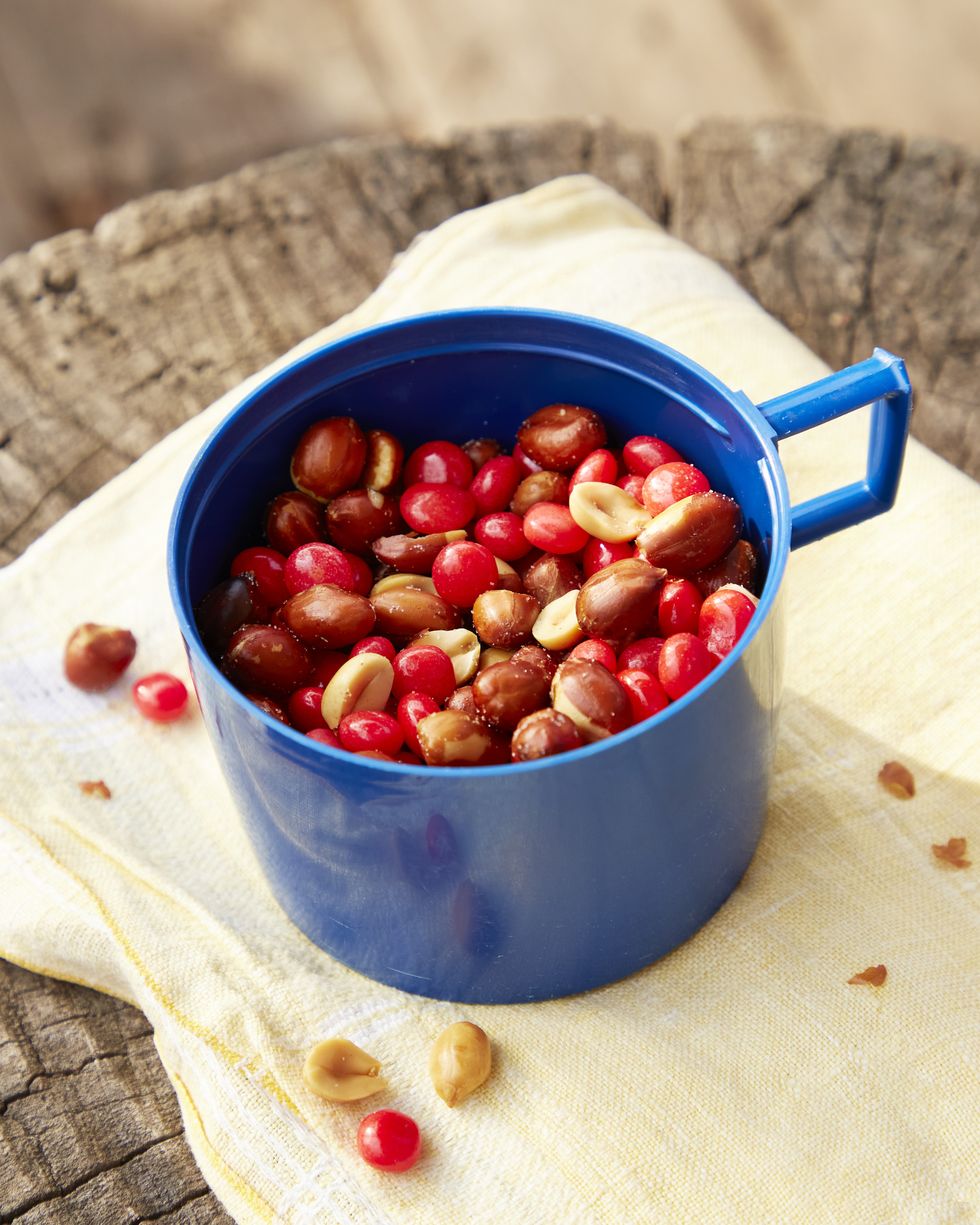 red hots spanish peanuts snack in a blue cup
