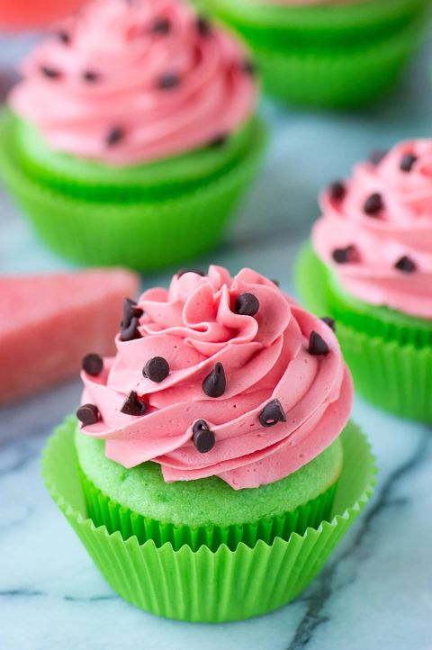 watermelon cupcakes with pink frosting and green base and chocolate chip seeds