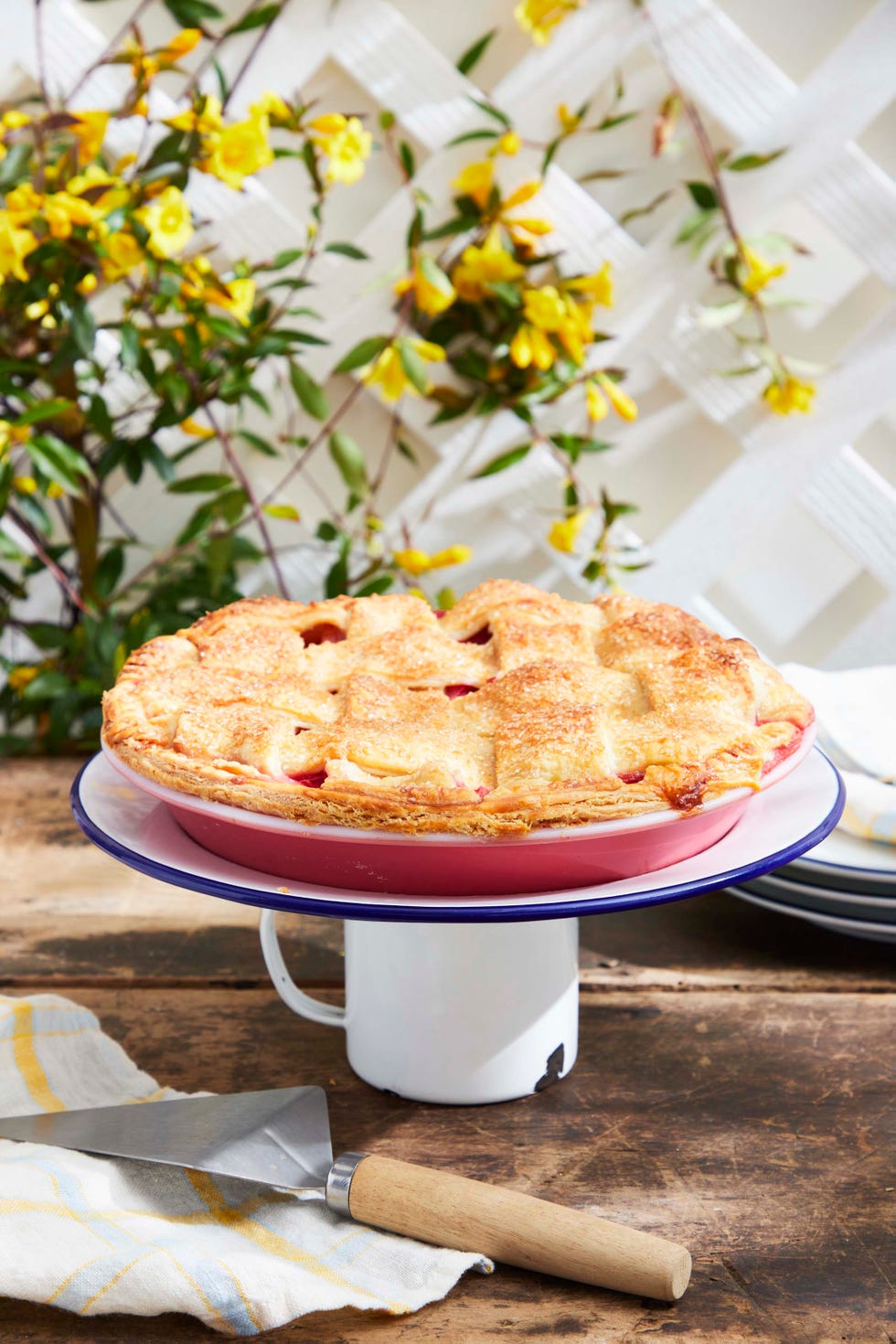 dessert stand made from a vintage enamelware plate and mug