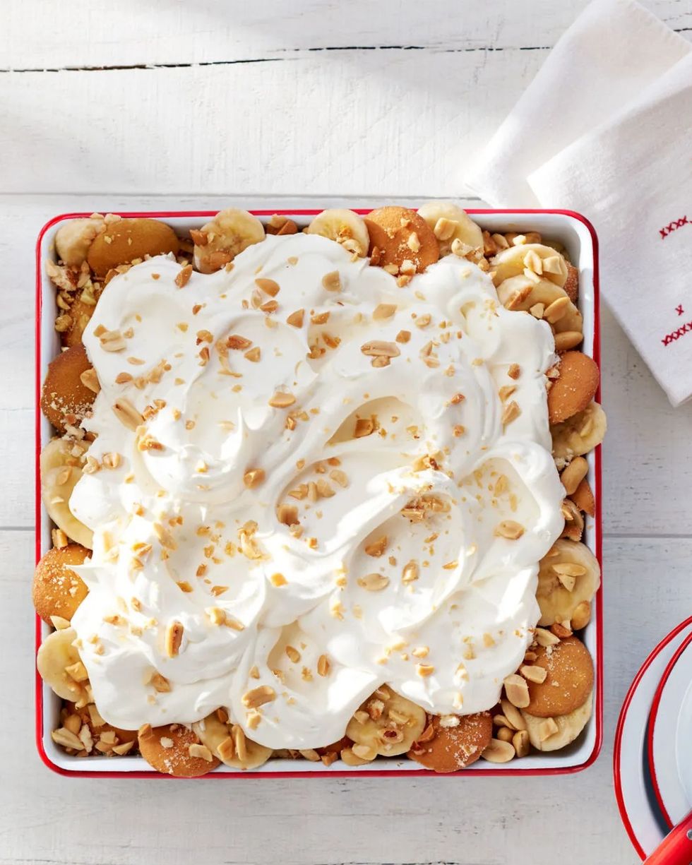salty peanut banana pudding in a red rimmed serving dish