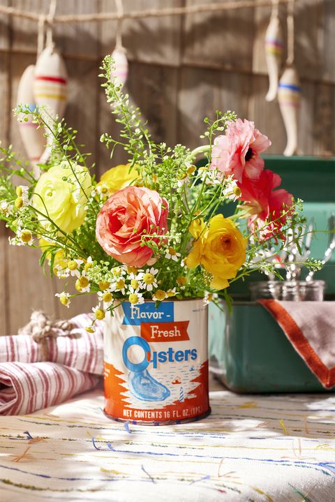 a vintage tin that says flavor fresh oysters filled with flowers