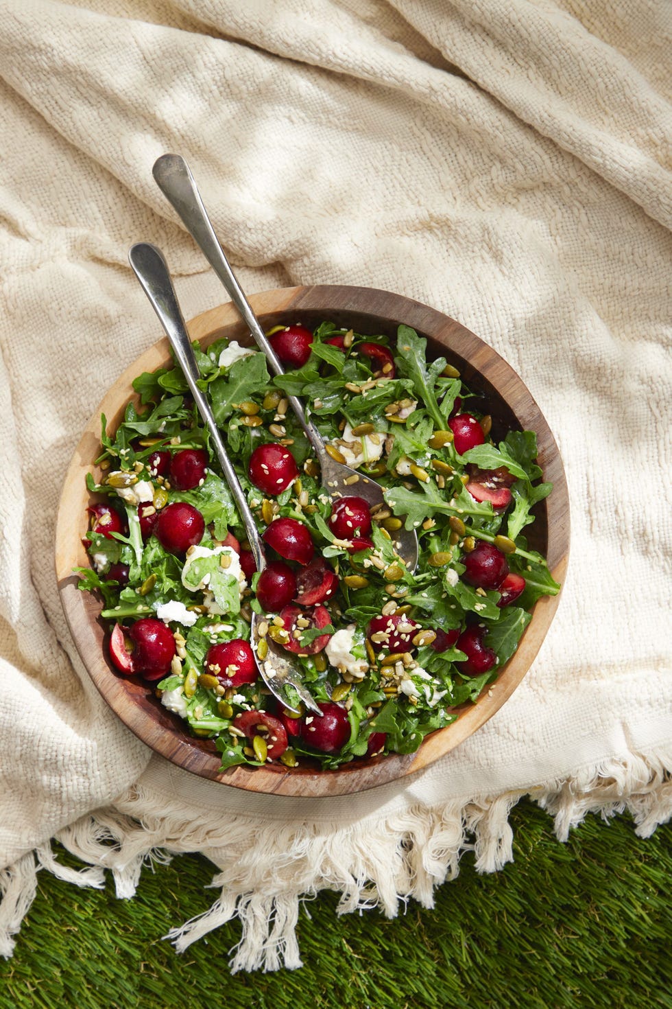 cherry arugula and goat cheese salad with toasted seeds