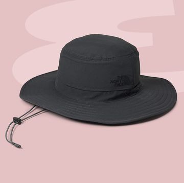 a black hat on a white surface