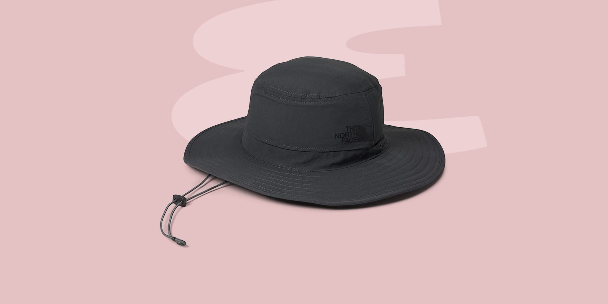 a black hat on a white surface