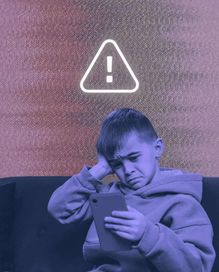 a sad kid looking at his phone