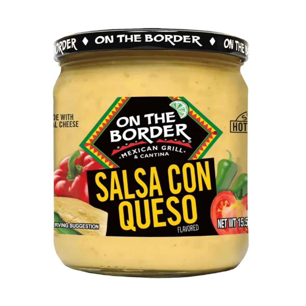 a clear jar containing a creamy yellow dip labeled as salsa con queso