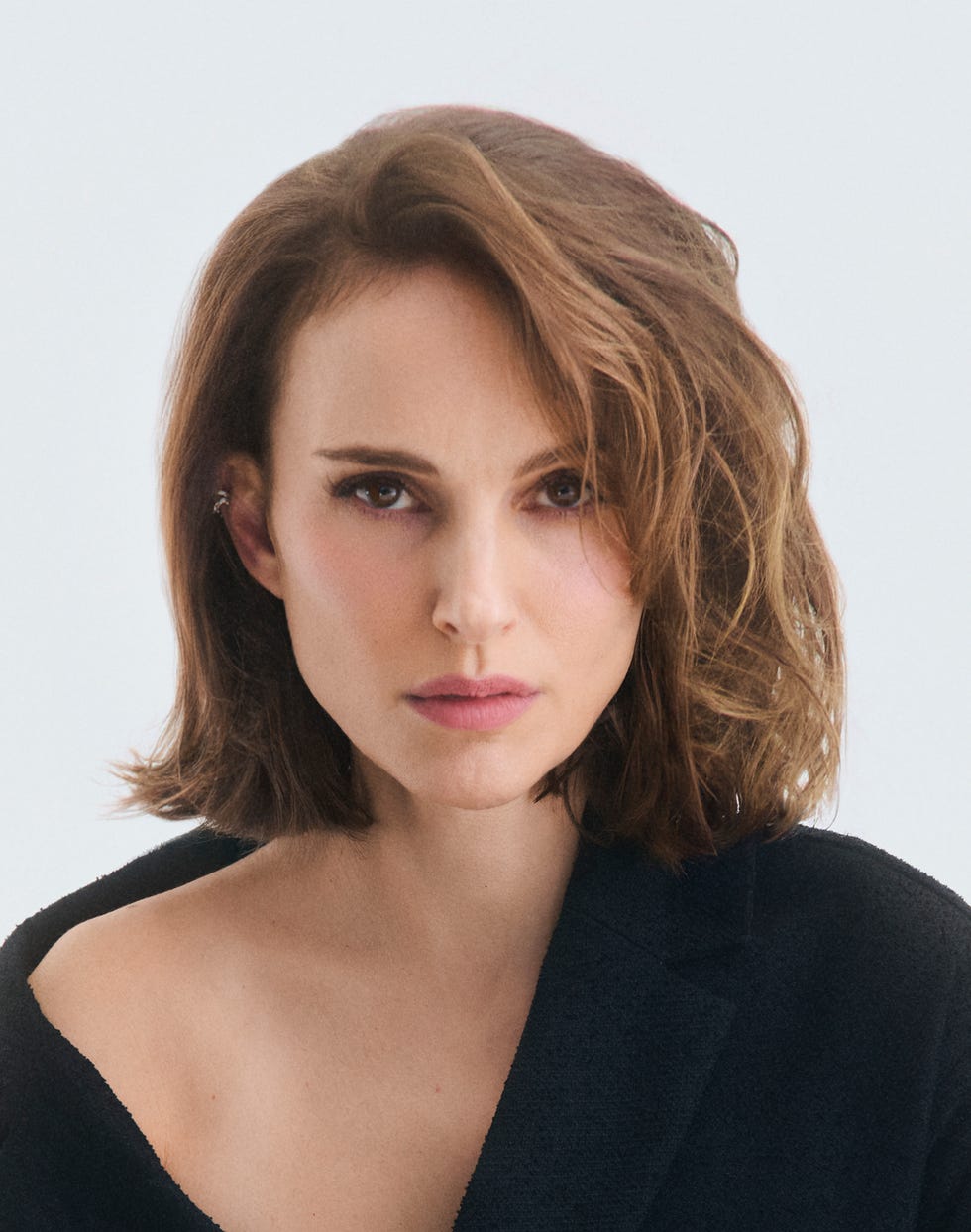 portrait showcasing a person with mediumlength hair and a dark jacket