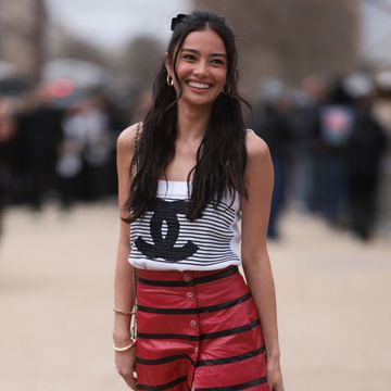 paris, france march 05 kelsey merritt seen wearing a black and white striped chanel top, black and red striped long skirt, black chanel ballerinas and a mini brown and black chanel handbag outside chanel show, during the womenswear fallwinter 20242025 as part of paris fashion week on march 05, 2024 in paris, france photo by jeremy moellergetty images