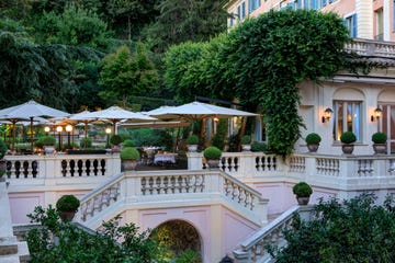 outdoor terrace and round tables with umbrellas