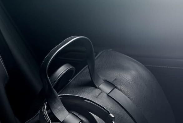 a pair of black headphones on a black car seat