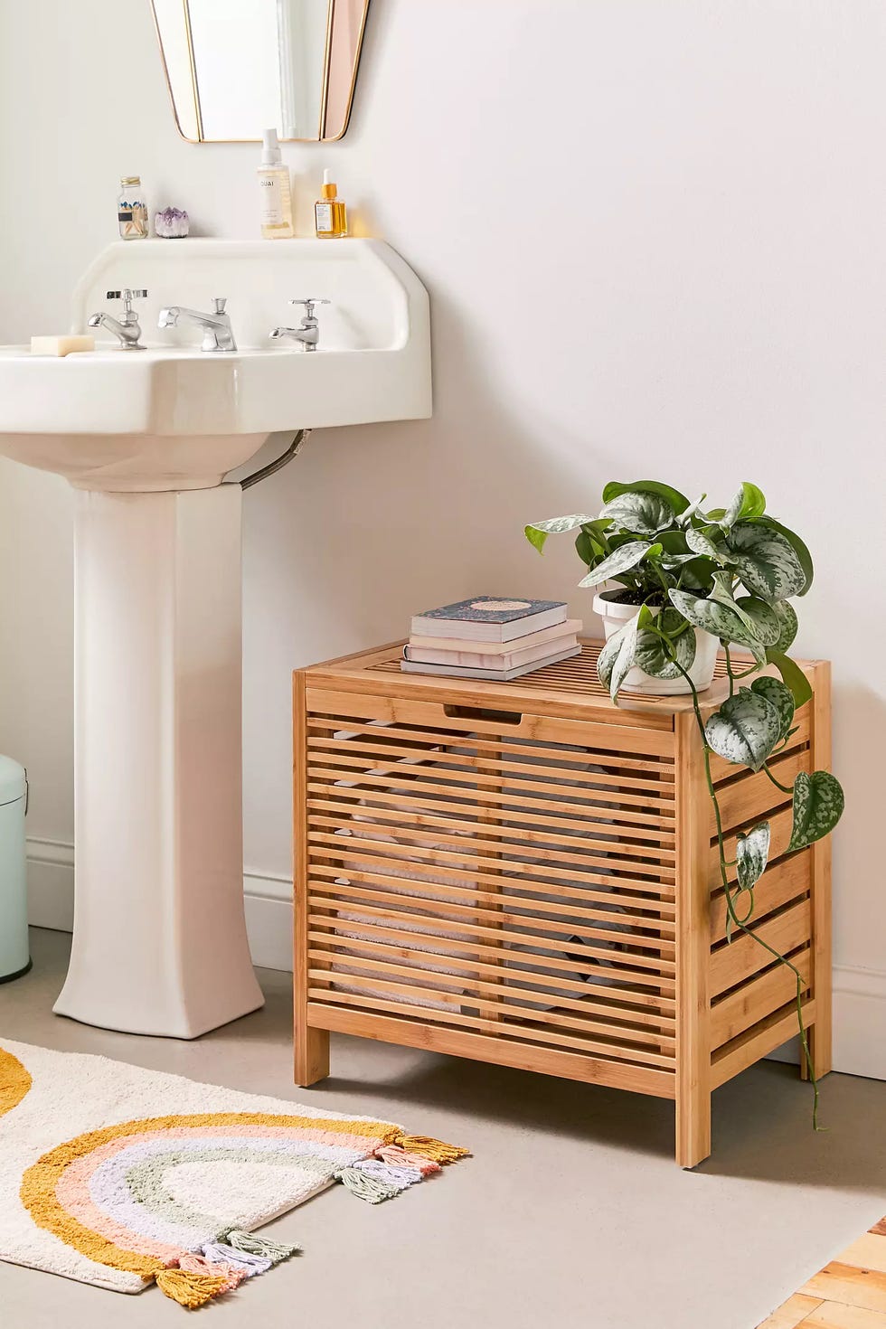 bathroom setup with a sink storage and greenery