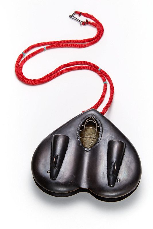 a computer mouse with a red cord