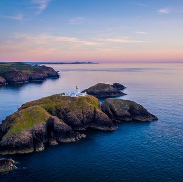 Stumblehead lighthouse view of coastline and lighthouse at sunset