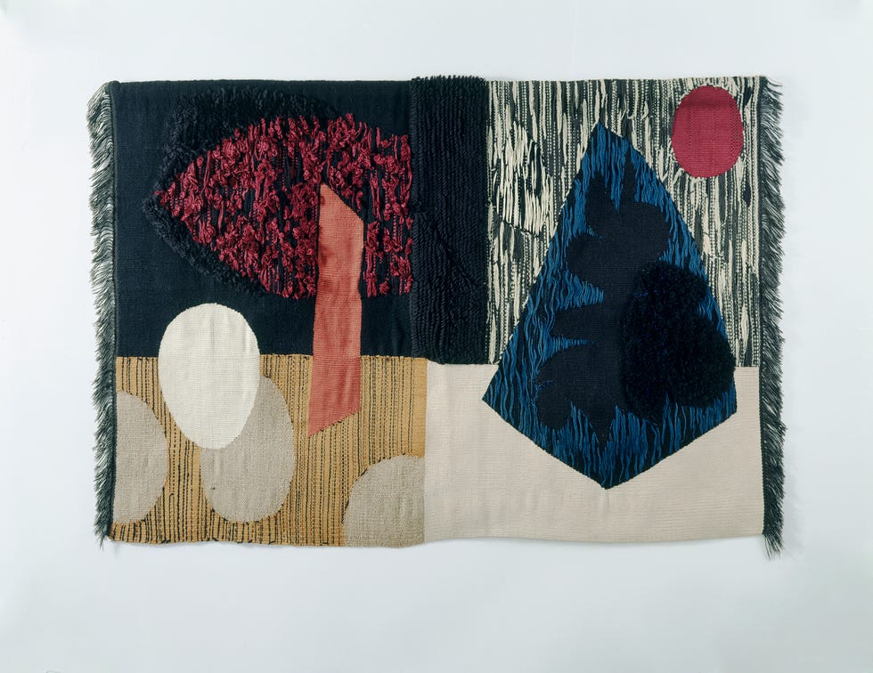 Abstract textile art with geometric shapes and varied textures.