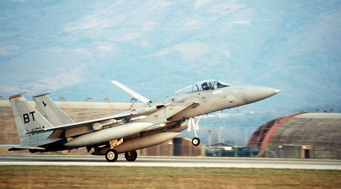 a f15c eagle aircraft returns to base after a mission