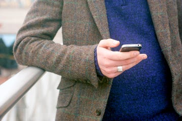 Outerwear, Hand, Jacket, Finger, Street fashion, Blazer, Coat, Sweater, Electronic device, Pocket, 