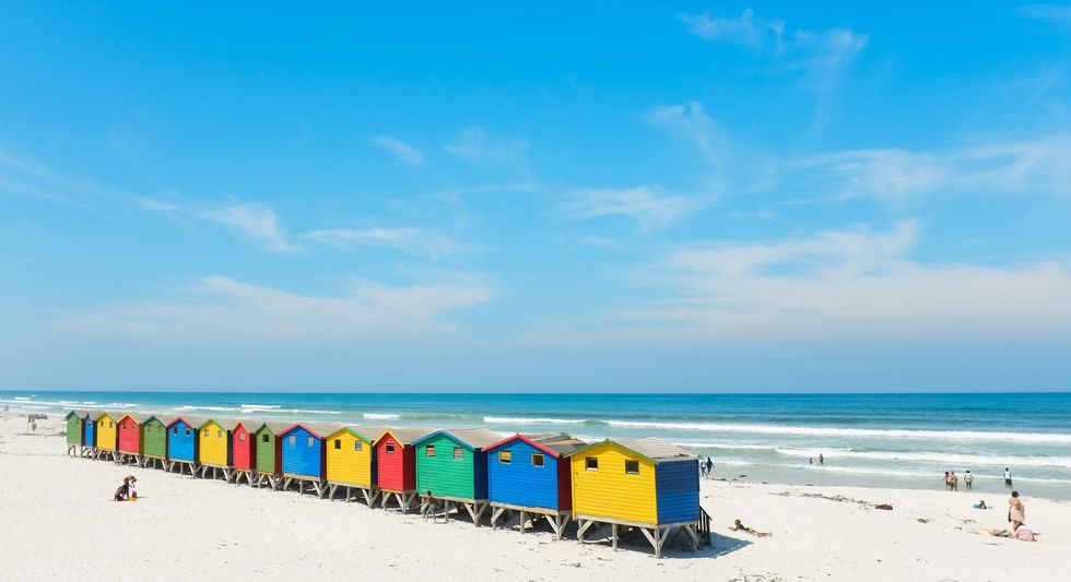 a group of colorful buildings on a beach
