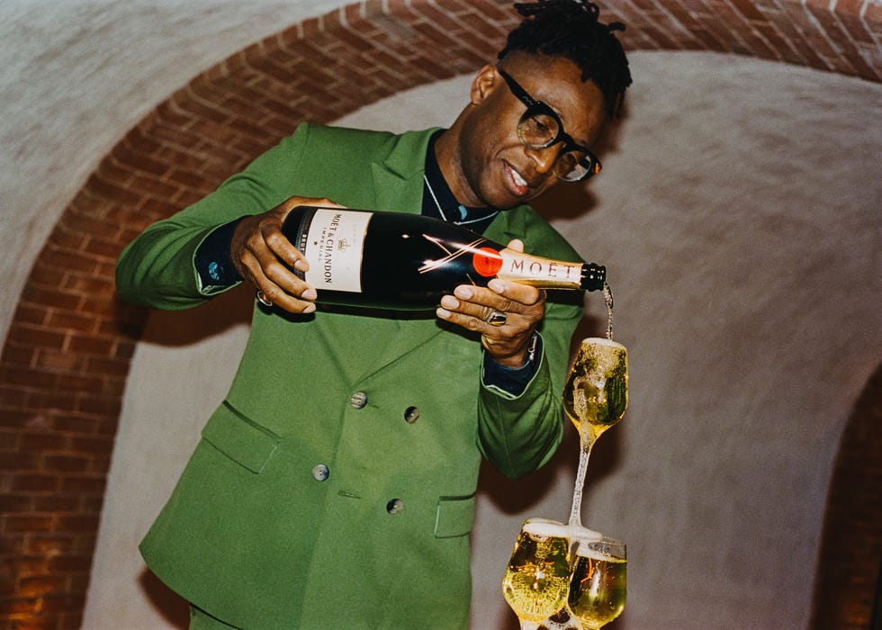 foday dumbuya pours champagne