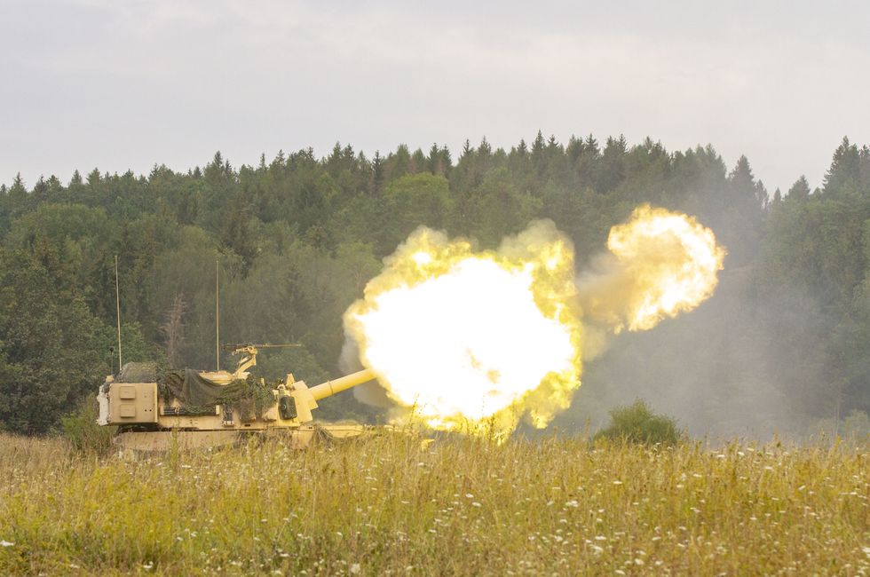 an army paladin m109a7 artillery system belonging to delta battery, 1st battalion, 5th field artillery regiment, 1st armored brigade combat team, 1st infantry division, fires rounds during a live fire exercise on a range at grafenwoehr training area, germany, aug 6, 2019 the 1 5 fa is participating in combined resolve xii, a multinational exercise designed to increase the readiness of allied forces during atlantic resolve us army photo by sgt jeremiah woods