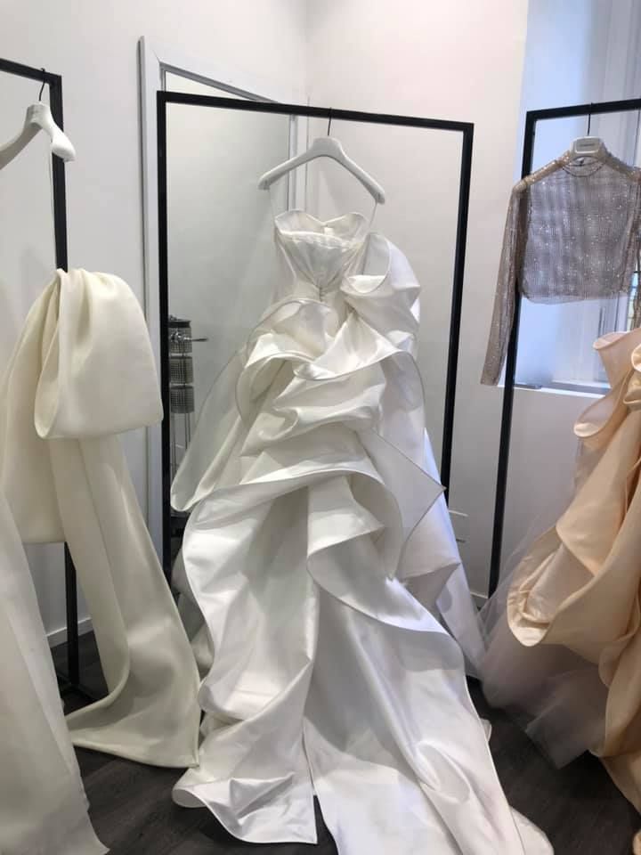 White, Dress, Wedding dress, Clothing, Bridal clothing, Gown, Fashion design, Bridal party dress, Bridal accessory, Room, 