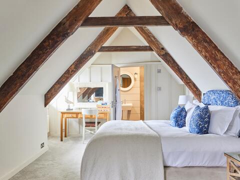 a bedroom with a large mirror