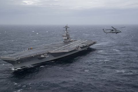 atlantic ocean oct 27, 2019 an mh 60s sea hawk helicopter assigned to the dragonslayers of helicopter sea combat squadron hsc 11 flies by uss gerald r ford cvn 78 ford is conducting sea trials following its 15 month post shakedown availability us navy photo by mass communication specialist 3rd class connor loessin