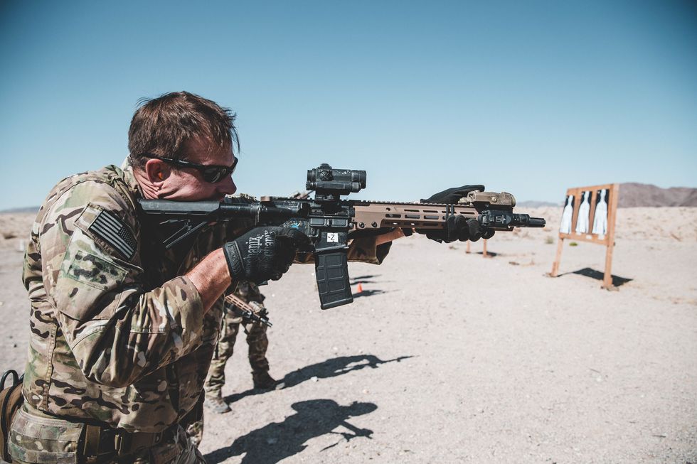 a us army special operation soldier with 3rd battalion, 3rd special forces group airborne fires a m4a1 rifle during flat range training at marine corps air ground combat center mcagcc, twentynine palms, calif, oct 14, 2019 the green berets used the mcagcc training areas to refine detachment tactics and prepare for combat operations us marine corps photo by cpl william chockey