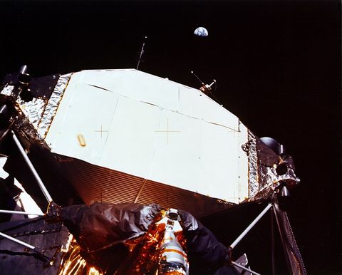 apollo 11 
lunar module with earth overhead