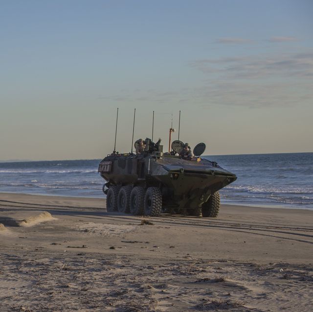 us marines with amphibious vehicle test branch, marine corps tactical systems support activity, drive new amphibious combat vehicles along the beach during low light surf transit testing at avtb beach on marine corps base camp pendleton, california, dec 18, 2019 the test was designed to assess and verify how well marines can interface with the vehicle and operate at night the acv is an eight wheeled armored personnel carrier designed to fully replace the corps’ aging fleet of amphibious assault vehicles  us marine corps photo by lance cpl andrew cortez