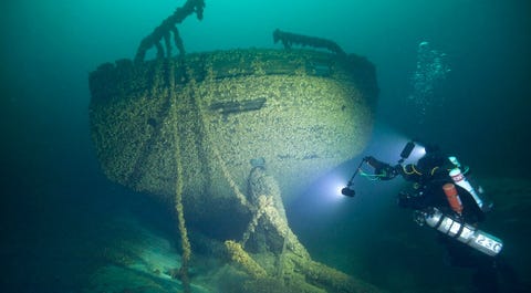 30 Stunning Shipwrecks That Will Blow Your Mind underwater, shipwreck, scuba diving, water, organism, underwater diving, recreation, diving equipment, marine biology, vehicle,