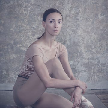 a woman sitting on the ground