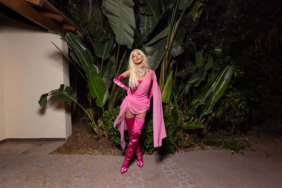 christina aguilera in a pink sash and gown