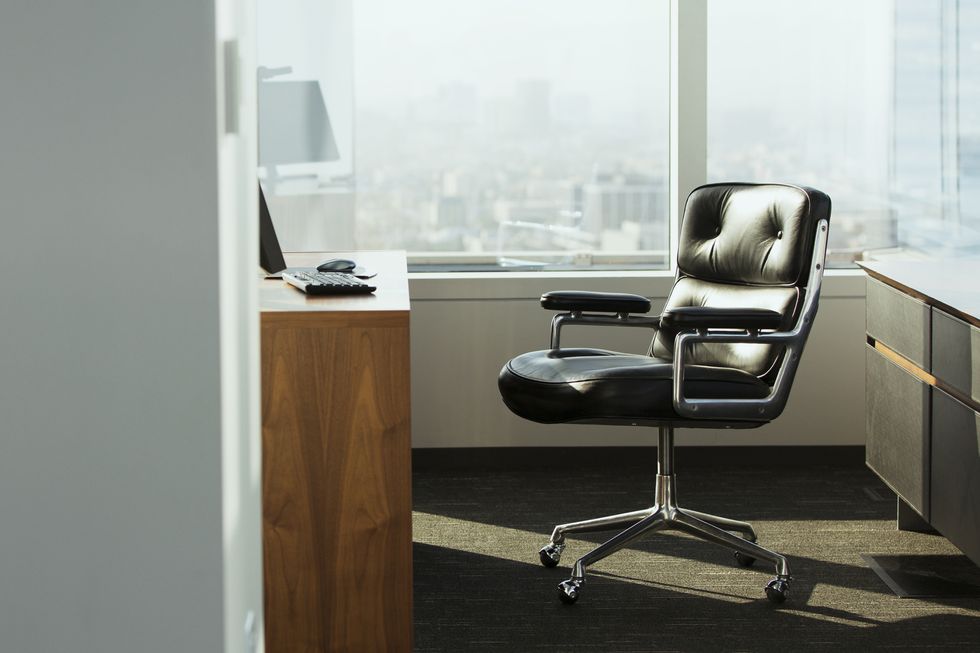 a chair and desk in an office