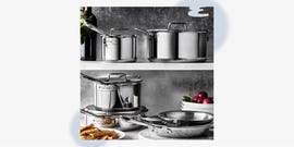 collection of stainless steel cookware arranged on shelves