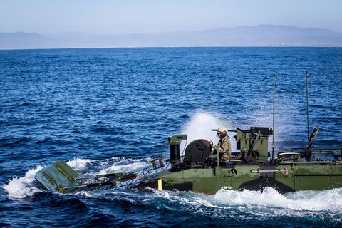 a us marine with the amphibious vehicle test branch, marine corps tactical systems support activity, watches from an open hatch as an amphibious combat vehicle is maneuvered into the amphibious transport dock ship uss somerset lpd 25 as part of the vehicle’s developmental testing off the shore of marine corps base camp pendleton, california, jan 29, 2020 the marines of avtb are currently testing the marine corps’ newest amphibious vehicle, which will replace the current amphibious assault vehicle the testing consisted of entering and departing a naval vessel to assess and verify how well the acv can integrate with naval shipping this was the first time marines have operated the new vehicle while boarding and departing a ship us marine corps photo by lance cpl drake nickels