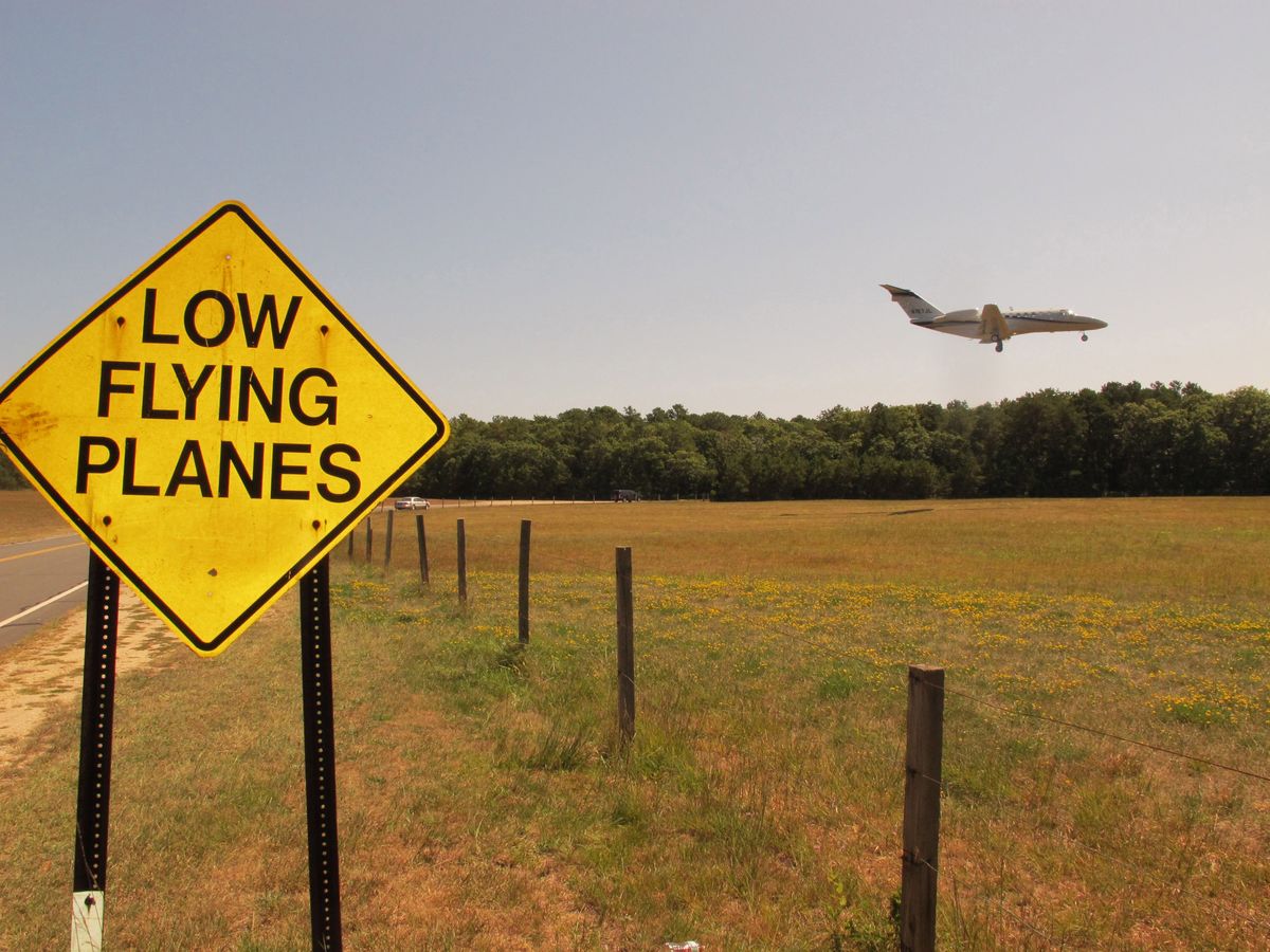 Airplane, Aircraft, Pasture, Plain, Land lot, Sign, Flight, Grassland, Field, Aerospace engineering, 