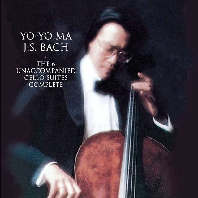 a man playing a cello