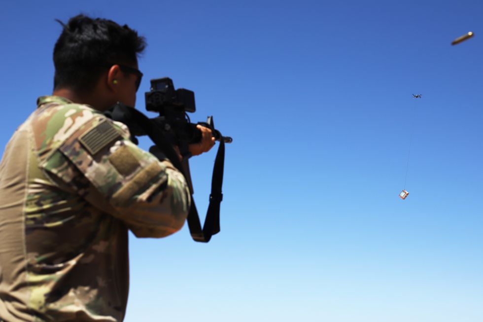 a soldier fires at a box carried by a drone during a smart shooter sighting device familiarization range near at tanf garrison, syria, may 30, 2020 coalition and partner forces regularly train on various weapon systems in a joint effort to help set conditions for the enduring defeat of daesh in syria us army photo by staff sgt william howard