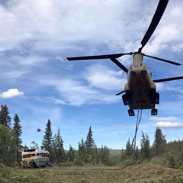 alaska army national guard soldiers assigned to 1st battalion, 207th aviation regiment execute an extraction mission via a ch 47 chinook helicopter over healy, alaska, june 18, 2020 as part of a combined effort with the department of natural resources, the guardsmen rigged and airlifted “bus 142”,, an historic icon from book and film, “into the wild”, out of its location on stampede road in light of public safety concerns the bus will be stored at a secure site while the dnr considers all options and alternatives for its permanent disposition alaska national guard courtesy photo
