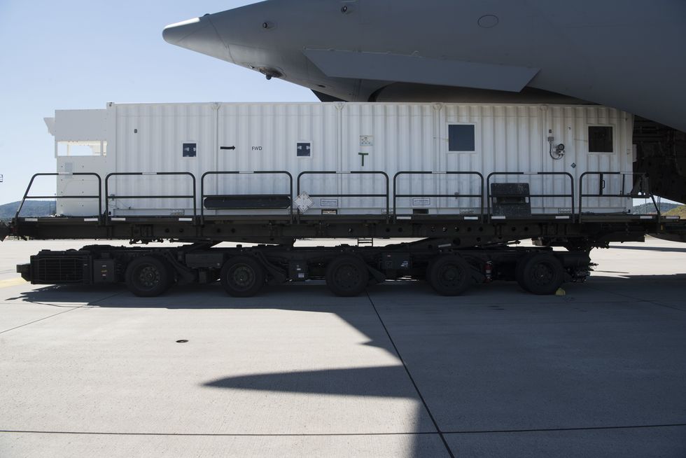 a negatively pressured conex sits on a k loader after 721st aerial port squadron personnel unloaded it from a c 17 at ramstein air base, germany, june 24, 2020 the npc is a more durable system than the existing transport isolation system the npc is an infectious disease containment unit designed to minimize contamination risk to aircrew and medical attendants, while allowing in flight medical care for patients afflicted by diseases like covid 19  us air force photo by senior airman milton hamilton