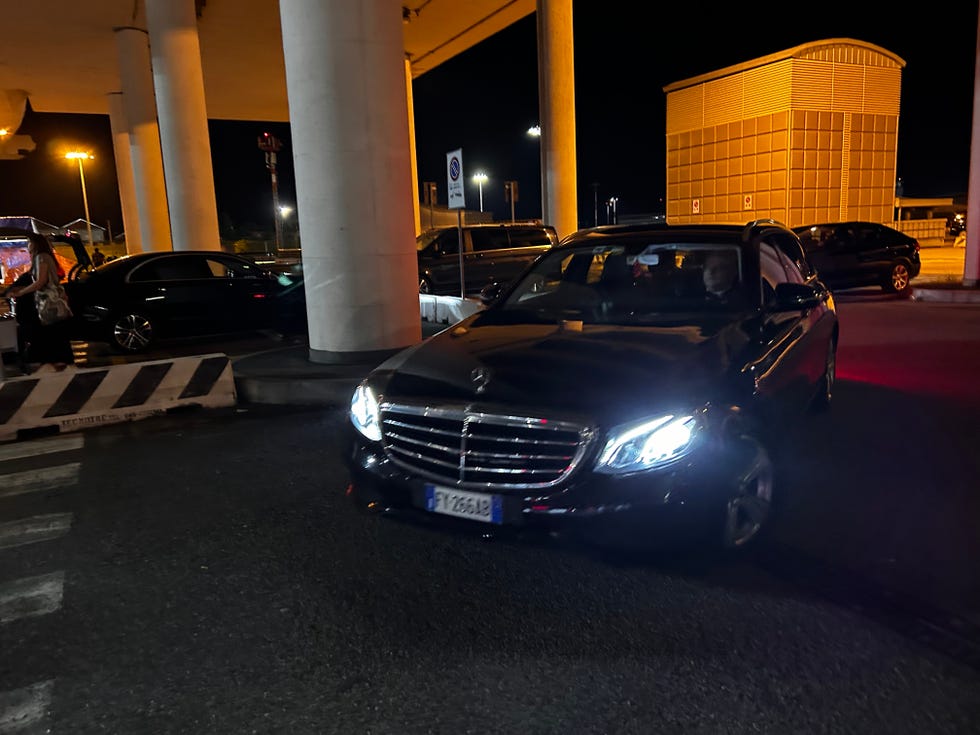 a black car parked in a parking lot